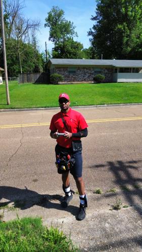 David Clark holding the drone controller at a property