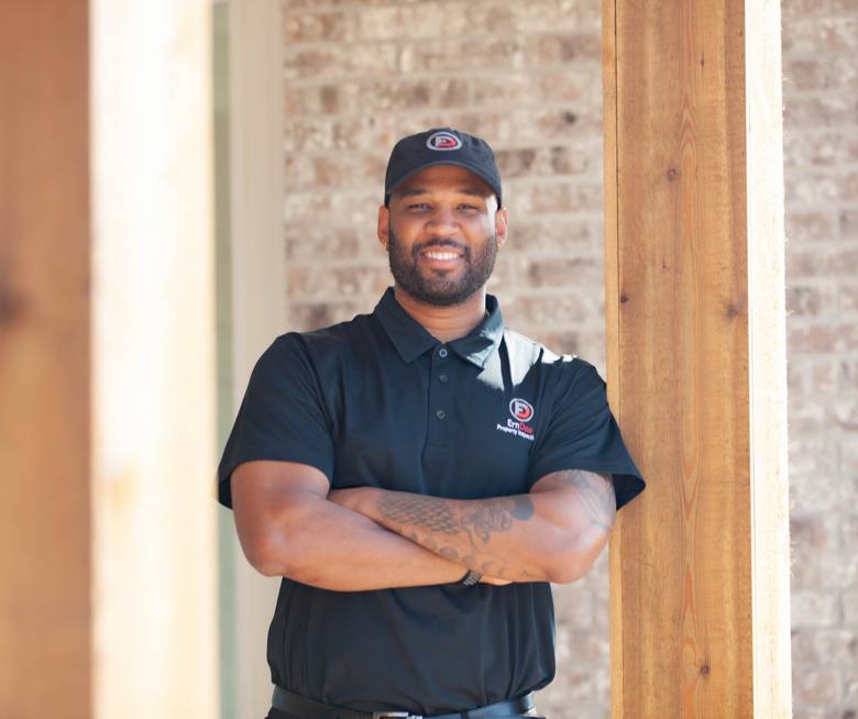 David Clark smiling in his ErnDae branded polo and cap