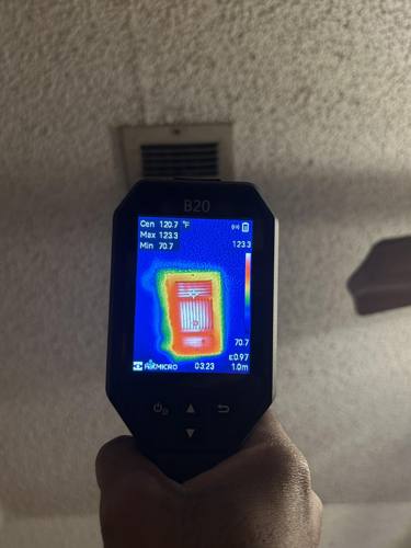 Thermal camera displaying surface temperatures at a ceiling vent